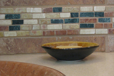 Inspiration for a transitional ceramic tile bathroom remodel in Grand Rapids with a drop-in sink and solid surface countertops