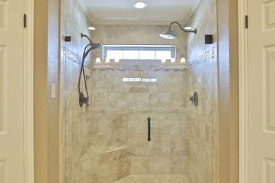 Doorless shower - large modern master beige tile and porcelain tile porcelain tile doorless shower idea in Austin with an undermount sink, raised-panel cabinets, white cabinets, granite countertops, a two-piece toilet and brown walls