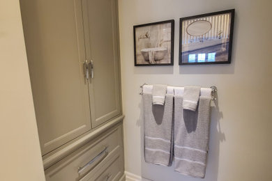Inspiration for a mid-sized transitional master double-sink double shower remodel in Toronto with shaker cabinets, gray cabinets, quartzite countertops, white countertops and a built-in vanity
