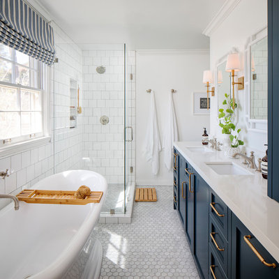 Example of a mid-sized beach style master white tile and ceramic tile marble floor, gray floor and double-sink bathroom design in San Francisco with shaker cabinets, blue cabinets, white walls, an undermount sink, quartz countertops, a hinged shower door, white countertops and a niche