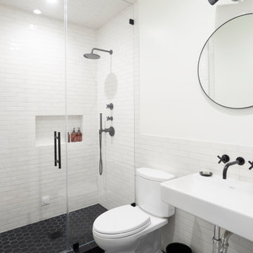 Black and White Tile Bathroom with Frameless Shower Door