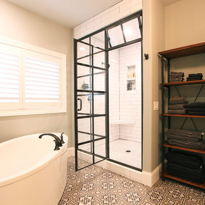 Inspiration for a mid-sized transitional master white tile and porcelain tile cement tile floor and multicolored floor bathroom remodel in Other with recessed-panel cabinets, gray cabinets, a one-piece toilet, gray walls, an undermount sink, quartz countertops and a hinged shower door
