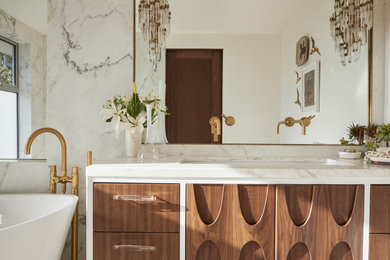 Example of a mid-sized 1960s white tile and marble tile marble floor and single-sink bathroom design in Los Angeles with furniture-like cabinets, brown cabinets, white walls, marble countertops, white countertops and a freestanding vanity