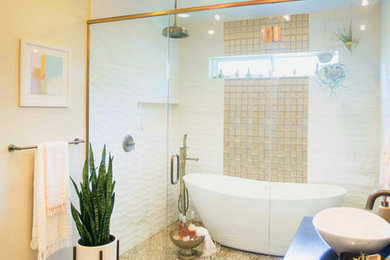 Photo of a bohemian bathroom in Other with glass tiles.
