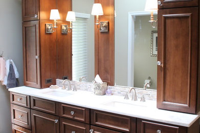 Example of a huge classic master multicolored tile and ceramic tile ceramic tile and beige floor walk-in shower design in Detroit with raised-panel cabinets, dark wood cabinets, a two-piece toilet, gray walls, an undermount sink, granite countertops, a hinged shower door and beige countertops