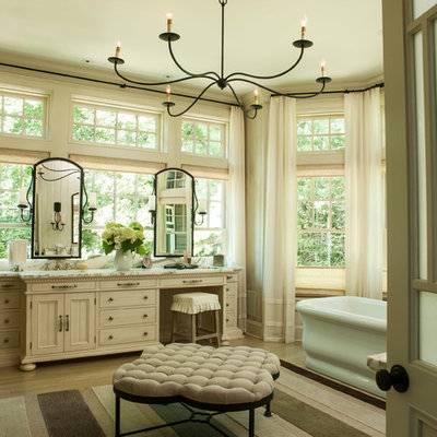 Freestanding bathtub - shabby-chic style master freestanding bathtub idea in Miami with beige cabinets