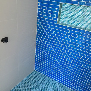 Blue hand made glass tile in the pool bath