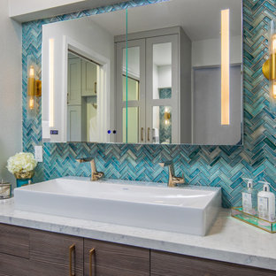 Large master blue tile green floor wet room photo in San Diego with flat-panel cabinets, dark wood cabinets, a one-piece toilet, white walls, a vessel sink, quartz countertops, a hinged shower door and white countertops