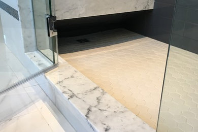 Example of a mid-sized arts and crafts master marble floor bathroom design in Edmonton with raised-panel cabinets, white cabinets, gray walls, an undermount sink and marble countertops