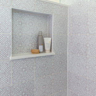 Example of a mid-sized transitional kids' white tile and mosaic tile gray floor corner shower design in Chicago with flat-panel cabinets, light wood cabinets, a two-piece toilet, pink walls, an undermount sink, quartz countertops, a hinged shower door and white countertops