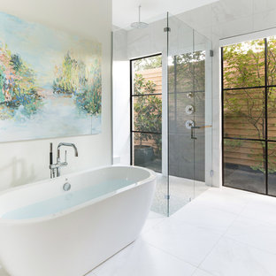 Inspiration for a large contemporary master white tile and marble tile white floor and marble floor bathroom remodel in Dallas with white walls, a hinged shower door, flat-panel cabinets, medium tone wood cabinets, an undermount sink, solid surface countertops and white countertops