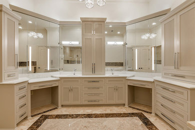 Bathroom - large transitional master beige tile and marble tile marble floor and beige floor bathroom idea in New Orleans with beaded inset cabinets, gray cabinets, a two-piece toilet, beige walls, an undermount sink, quartz countertops, a hinged shower door and white countertops