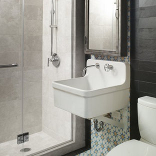 Example of an eclectic multicolored tile alcove shower design in New York with a wall-mount sink