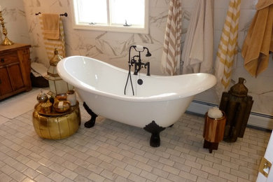 Design ideas for a large mediterranean ensuite bathroom in New York with freestanding cabinets, brown cabinets, a freestanding bath, an alcove shower, a one-piece toilet, white tiles, marble tiles, white walls, porcelain flooring, a vessel sink, wooden worktops, grey floors and a hinged door.