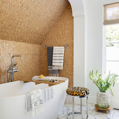 Inspiration for an eclectic master beige tile multicolored floor freestanding bathtub remodel in Minneapolis with white walls