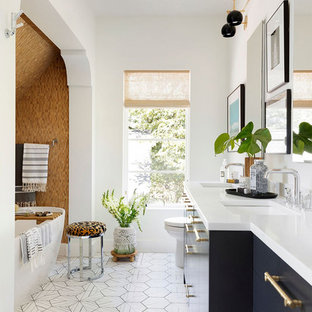 Freestanding bathtub - eclectic master beige tile multicolored floor freestanding bathtub idea in Minneapolis with flat-panel cabinets, black cabinets, white countertops, white walls and an undermount sink