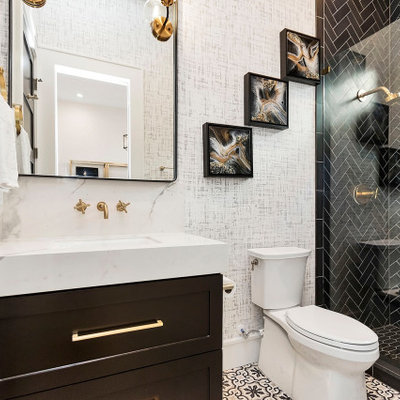 Transitional black tile multicolored floor alcove shower photo in Houston with shaker cabinets, black cabinets, white walls, an undermount sink and white countertops