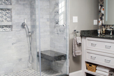 Inspiration for a large transitional master multicolored tile and stone tile ceramic tile double shower remodel in Other with beaded inset cabinets, white cabinets, a two-piece toilet, gray walls, an undermount sink and granite countertops