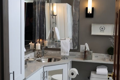 Mid-sized transitional gray tile and porcelain tile porcelain tile and gray floor alcove shower photo in Miami with shaker cabinets, white cabinets, a one-piece toilet, gray walls, an undermount sink, quartz countertops, a hinged shower door and white countertops