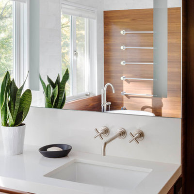 Example of a trendy corner bathtub design in Boston