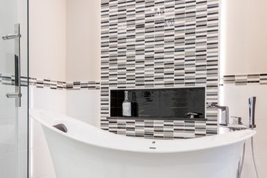 Example of a mid-sized trendy master black and white tile and porcelain tile porcelain tile bathroom design in Ottawa with flat-panel cabinets, dark wood cabinets, a one-piece toilet, gray walls, a vessel sink and quartz countertops