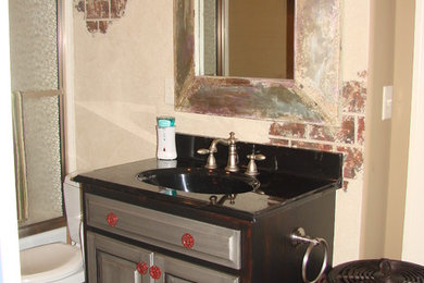 Bathroom - industrial bathroom idea in Other with granite countertops