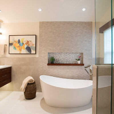 Inspiration for a large modern master beige tile and porcelain tile porcelain tile and beige floor bathroom remodel in DC Metro with flat-panel cabinets, brown cabinets, a one-piece toilet, beige walls, a drop-in sink, quartz countertops and white countertops