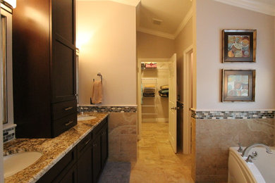 Example of a mid-sized trendy master beige tile and porcelain tile porcelain tile bathroom design in Tampa with shaker cabinets, dark wood cabinets, a two-piece toilet, beige walls, an undermount sink and granite countertops