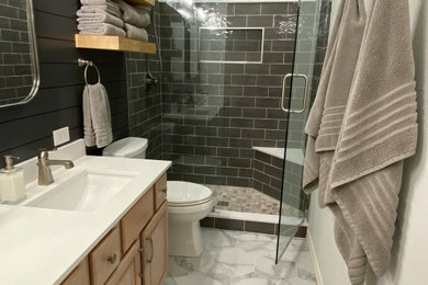Inspiration for a small farmhouse 3/4 gray tile and subway tile porcelain tile, gray floor, double-sink and shiplap wall bathroom remodel in Dallas with raised-panel cabinets, light wood cabinets, gray walls, an undermount sink, quartz countertops, a hinged shower door, white countertops and a built-in vanity