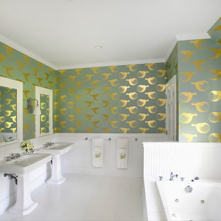 Design ideas for a large beach style master bathroom in New York with a pedestal sink, a drop-in tub, multi-coloured walls and painted wood floors.