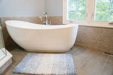 Large transitional master blue tile and ceramic tile ceramic tile and brown floor bathroom photo in Chicago with recessed-panel cabinets, white cabinets, a one-piece toilet, blue walls, a drop-in sink, marble countertops, a hinged shower door and white countertops
