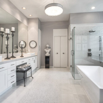 Bathroom - large modern master white tile and porcelain tile marble floor and white floor bathroom idea with shaker cabinets, white cabinets, gray walls, a vessel sink, marble countertops, a hinged shower door and white countertops