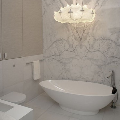 Trendy marble tile freestanding bathtub photo with a wall-mount toilet