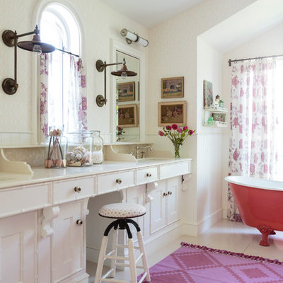 Claw-foot bathtub - large eclectic master beige tile painted wood floor and white floor claw-foot bathtub idea in Los Angeles with shaker cabinets, white cabinets, an undermount sink, limestone countertops and beige walls