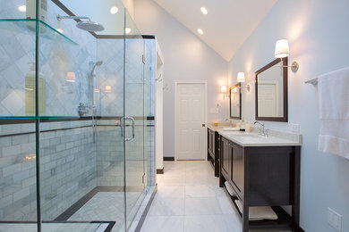 Medium sized classic ensuite bathroom in Chicago with recessed-panel cabinets, dark wood cabinets, a built-in bath, a corner shower, white walls, a submerged sink, marble worktops and a hinged door.