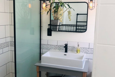 Photo of a victorian wet room bathroom in Sussex with grey cabinets, a wall mounted toilet, ceramic tiles, porcelain flooring, a pedestal sink, an open shower, a single sink and a freestanding vanity unit.