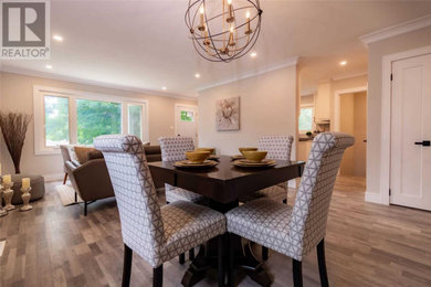 Small elegant gray floor dining room photo in Toronto with gray walls