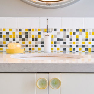 This is an example of an eclectic bathroom in Other with yellow tile and mosaic tile.