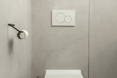 Aménagement d'une petite salle de bain principale moderne en bois brun avec un placard à porte affleurante, un plan de toilette en béton et un plan de toilette rose.