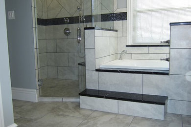 Inspiration for a large modern master gray tile and ceramic tile ceramic tile bathroom remodel in Other with raised-panel cabinets, white cabinets, marble countertops, a bidet and gray walls
