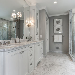 Classic ensuite bathroom in Atlanta with a submerged sink, recessed-panel cabinets, white cabinets, a corner shower and grey walls.