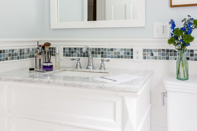 Bathroom - small transitional master white tile and porcelain tile porcelain tile bathroom idea in Boston with white cabinets, a one-piece toilet, blue walls, an undermount sink and marble countertops