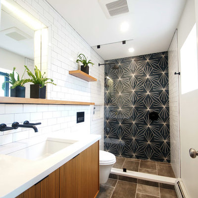 Small minimalist 3/4 white tile and subway tile porcelain tile and gray floor wet room photo in Boston with flat-panel cabinets, medium tone wood cabinets, a one-piece toilet, gray walls, an undermount sink, quartz countertops, a hinged shower door and white countertops