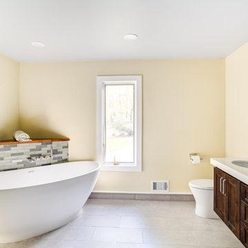 Brown Cabinets with Stand Alone Bathtub