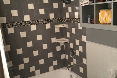 Example of a small transitional master gray tile and ceramic tile ceramic tile bathroom design in Dallas with recessed-panel cabinets, gray cabinets, a one-piece toilet, gray walls and a pedestal sink