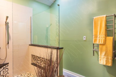 Mid-sized arts and crafts master beige tile and porcelain tile porcelain tile and gray floor doorless shower photo in Richmond with recessed-panel cabinets, dark wood cabinets, a two-piece toilet, green walls, an undermount sink, wood countertops, a hinged shower door and black countertops
