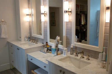 Inspiration for a bathroom remodel in Toronto with white cabinets and granite countertops