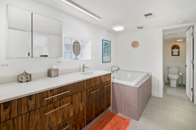 Large retro bathroom in Chicago with white walls.