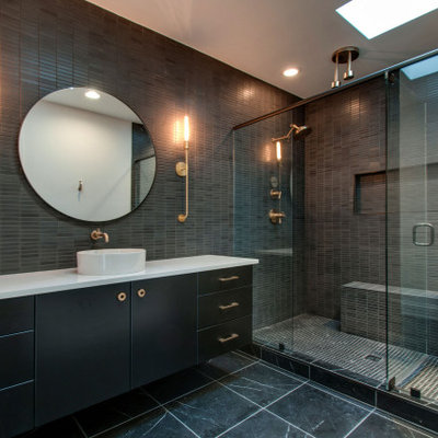Double shower - contemporary gray tile and mosaic tile gray floor and single-sink double shower idea in Nashville with flat-panel cabinets, black cabinets, a vessel sink, a hinged shower door, white countertops, a niche and a floating vanity