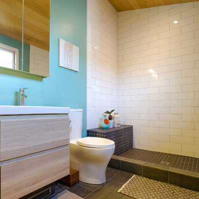 Trendy white tile and subway tile bathroom photo in San Francisco with flat-panel cabinets, light wood cabinets and a two-piece toilet